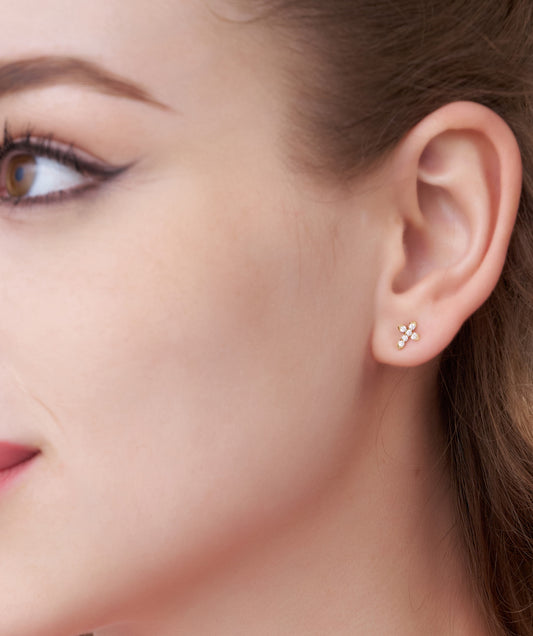 Model Wearing Dainty Diamond Cross Stud Earrings