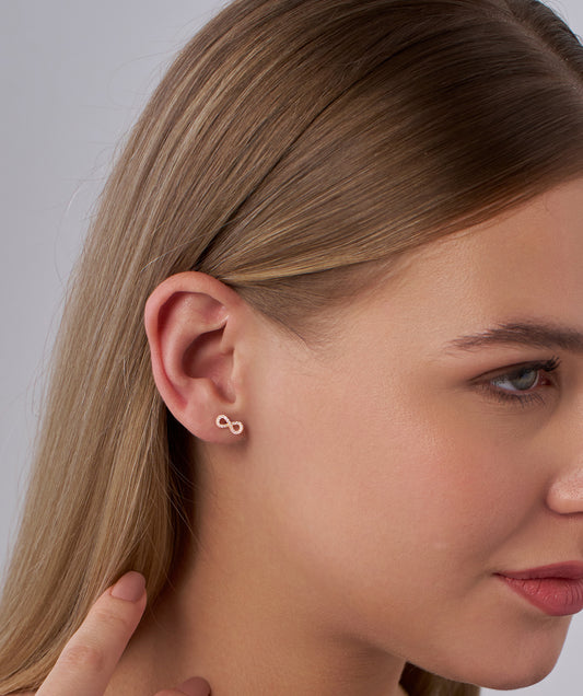 Model Wearing Pave Diamond Infinity Symbol Stud Earrings