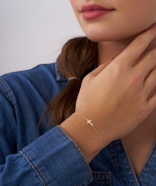 Model Wearing Minimal Diamond Cross Bracelet