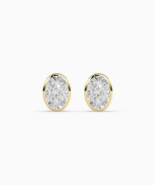 A pair of 14K gold bezel-set diamond stud earrings.