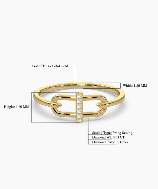 Gold ring with diamond accents on a white background
