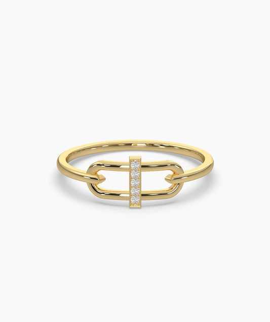 Gold ring with diamond accents on a white background