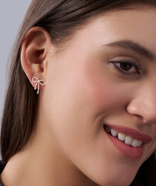 Model Wearing Pave Diamond Bow Stud Earrings with Baguette Drops