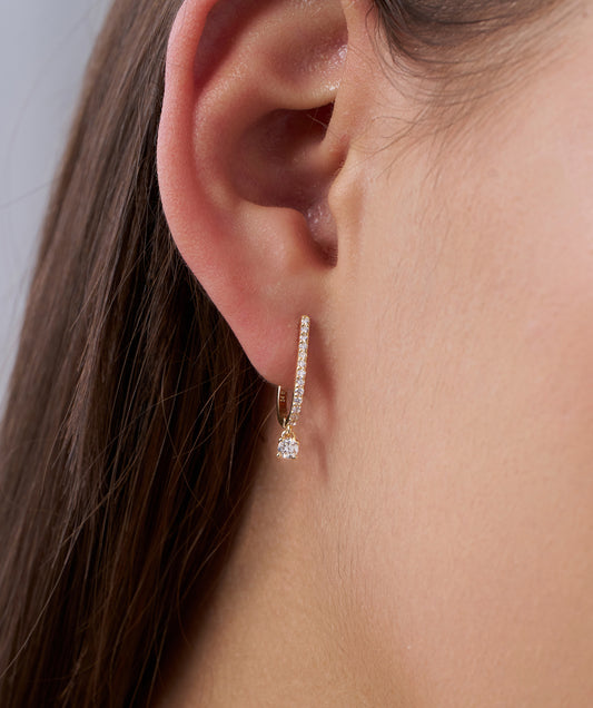 Model Wearing Pavé Diamond Huggie Hoops with Solitaire Drop