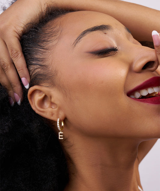 Model Wearing Pave Diamond Initial Drop Huggie Earrings 