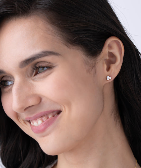 Model Wearing Classic Prong Set Trio Diamond Stud Earrings